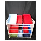 Storage shelf with multi-color plastic bins