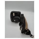 Fujifilm Instax Mini 9 camera with strap
