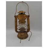 Yellow metal lantern with bulb
