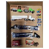 Toy trucks cars trailers and horse wagon