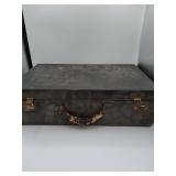 Hard-sided suitcase with locks and key