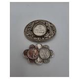 Two metal belt buckles with coin motif