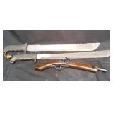 Two machetes with saw back and wood replica pistol