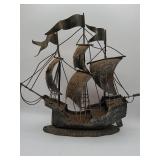 Metal sailing ship sculpture