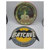 Coca-Cola tin sign and Batcave sign