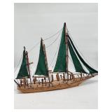 Wooden Sailboat Model with Green Sails
