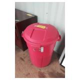 Plastic garbage can filled with filing folders