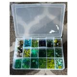 Assorted beads in various shapes, sizes and materi