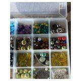 Assorted beads in various shapes, sizes and materi