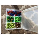 Assorted beads in various shapes, sizes and materi