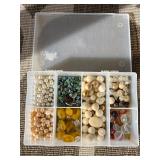 Assorted beads in various shapes, sizes and materi