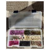 Assorted beads in various shapes, sizes and materi