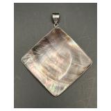 pendant featuring a large, diamond-shaped