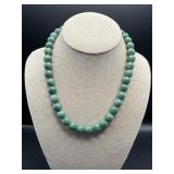Light green bead necklace.