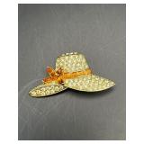 vintage brooch by Monet features a gold-tone hat