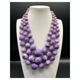 Triple strand purple graduated beads necklace