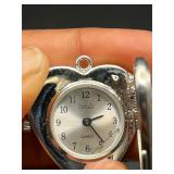 Ladies heart shape peekaboo Details watch.