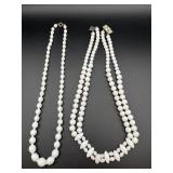 White bead necklaces.