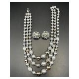 Triple strand Japan necklace and clip on earrings.