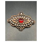 Brooch pin.