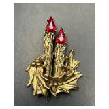 vintage brooch features two candles