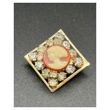 vintage cameo brooch features a carved lady's