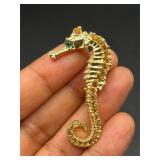 Seahorse brooch pin.