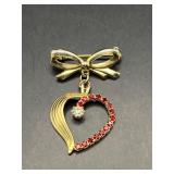 delicate bow dangling heart brooch