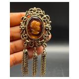 Vintage Cameo marked brooch pin. Dangling chains.