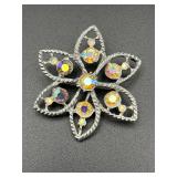 flower pin features iridescent aurora borealis