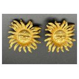 Gold tone sun face clip-on earrings.