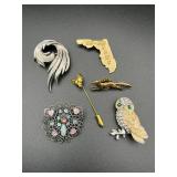 Brooches lot. One is marked Trifari.
