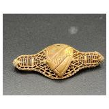 vintage filigree heart brooch features 'Mother'