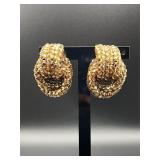 Large clip on earrings.
