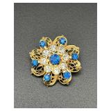 Vintage flower brooch pin. Blue clear rhinestones.