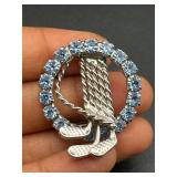 Golf clubs brooch pin blue rhinestones circle.