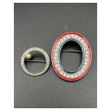 Two brooches.