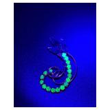 vintage brooch features green uranium glass.