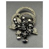 vintage-style brooch features a floral brooch pin