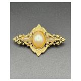 Brooch pin.