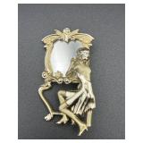 vintage AJC brooch features a seated woman