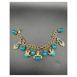 Bracelet with blue beads charm.