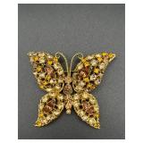 Rhinestone butterfly brooch pin.