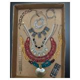 Jewelry tray. Assortment of jewelry pieces.