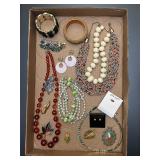 Jewelry tray. Assortment of jewelry pieces.