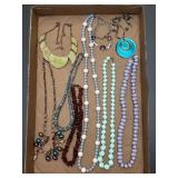 Jewelry tray. Assortment of jewelry pieces.