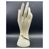 gold-toned cuff or bangle bracelet