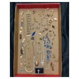 Jewelry tray. Assortment of jewelry pieces.