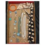 Jewelry tray. Assortment of jewelry pieces.