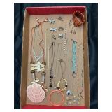 Jewelry tray. Assortment of jewelry pieces.